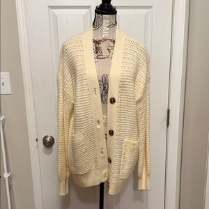 Cardigan in size large.  Cream colored.  Unworn.